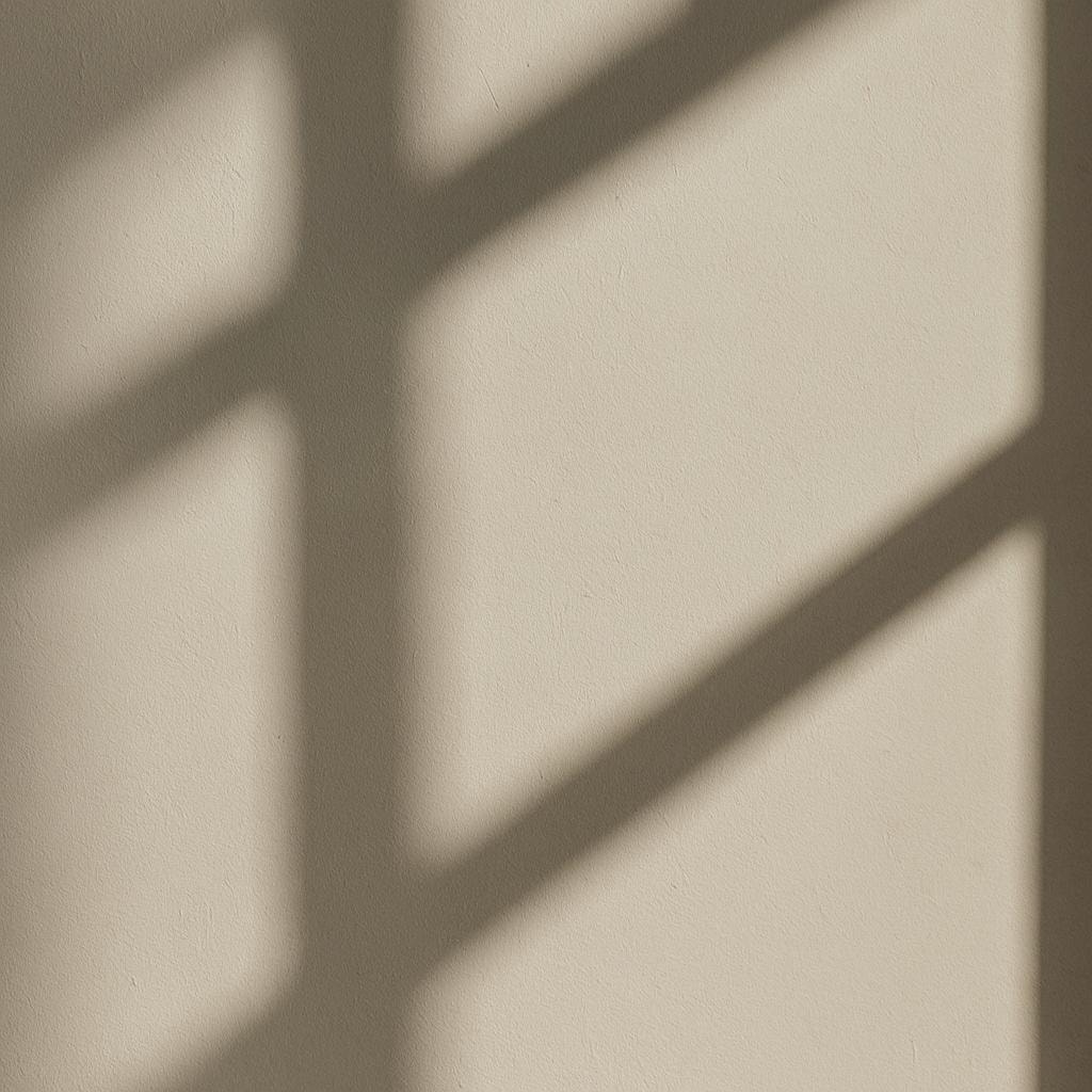 Soft window shadow on a beige wall — ambient background